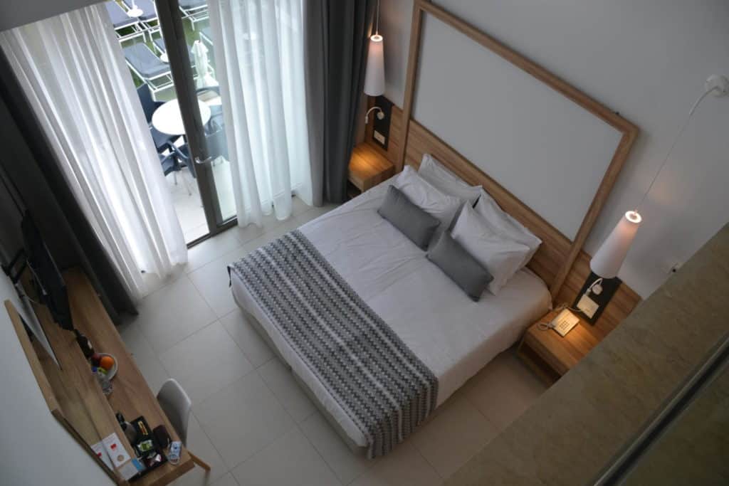 King sized bed from balcony in Superior Loft Maisonette at Kiani Beach Resort Crete