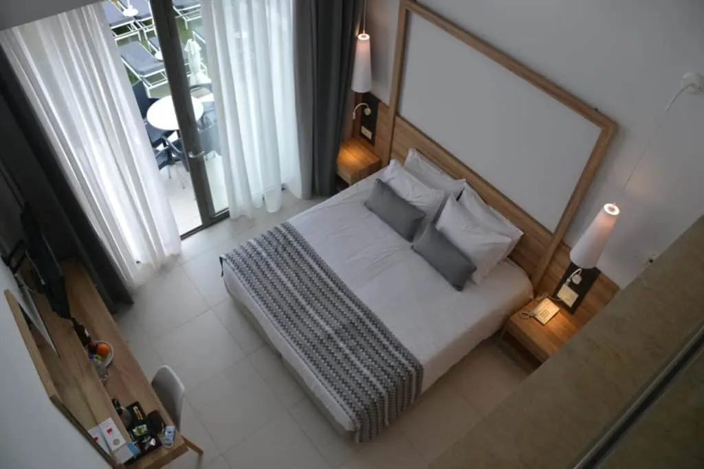 King sized bed from balcony in Superior Loft Maisonette at Kiani Beach Resort Crete