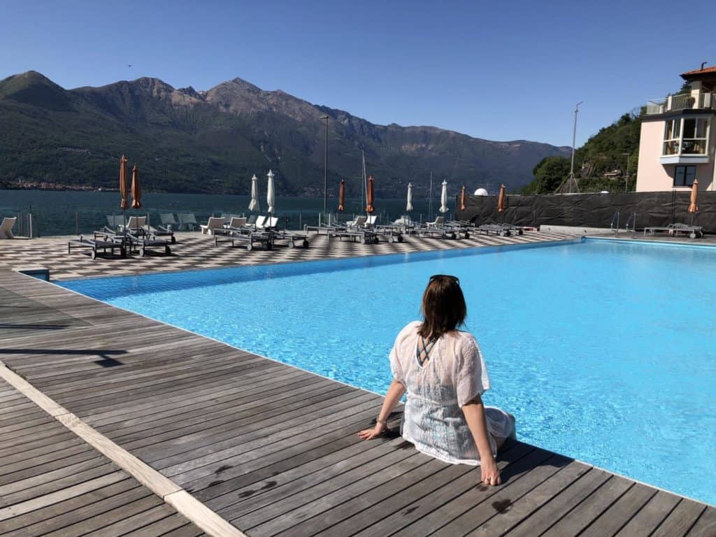 Claire sitting by pool at Golfo Gabella apartments - self-catering holidays in Lake Maggiore, Italy