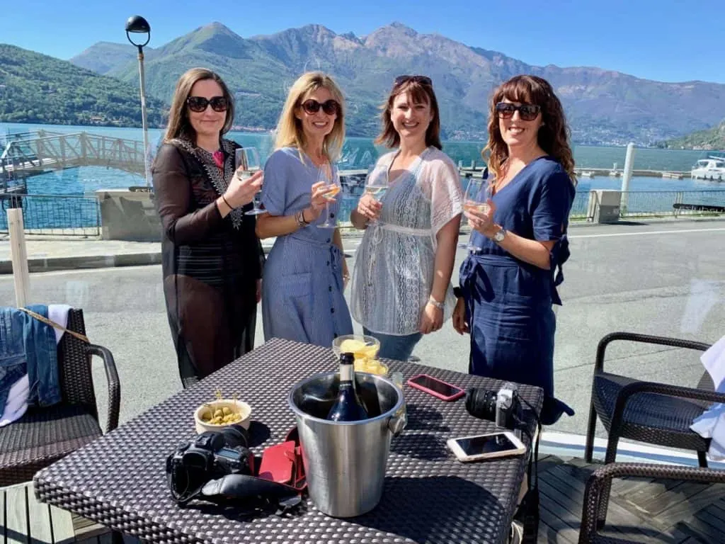Bloggers having drinks in Lake Maggiore, Italy