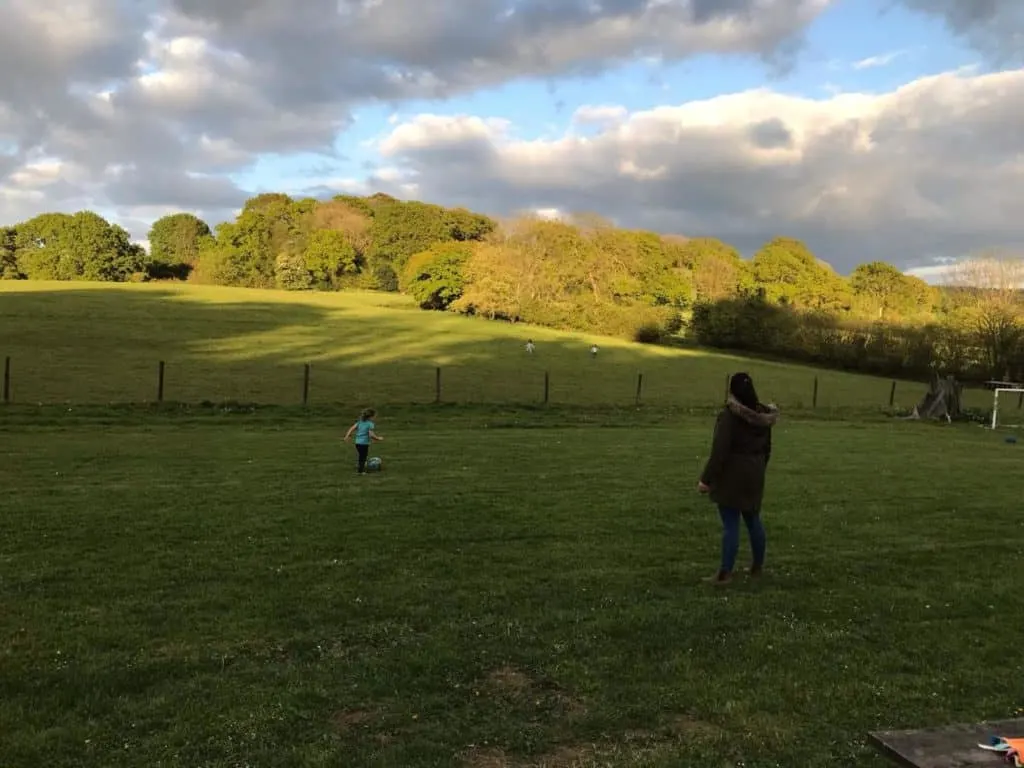 Playing in field at Blackdown Yurts