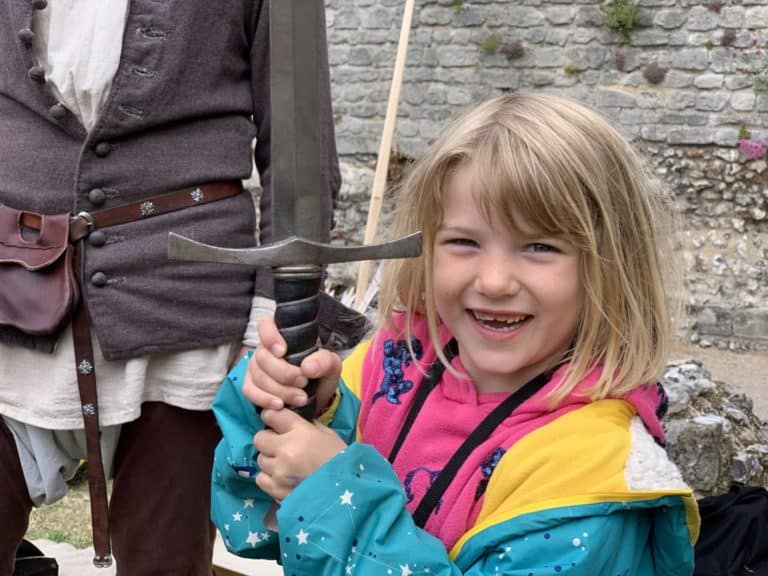 Tot holding sword at Portchester Castle in Hampshire