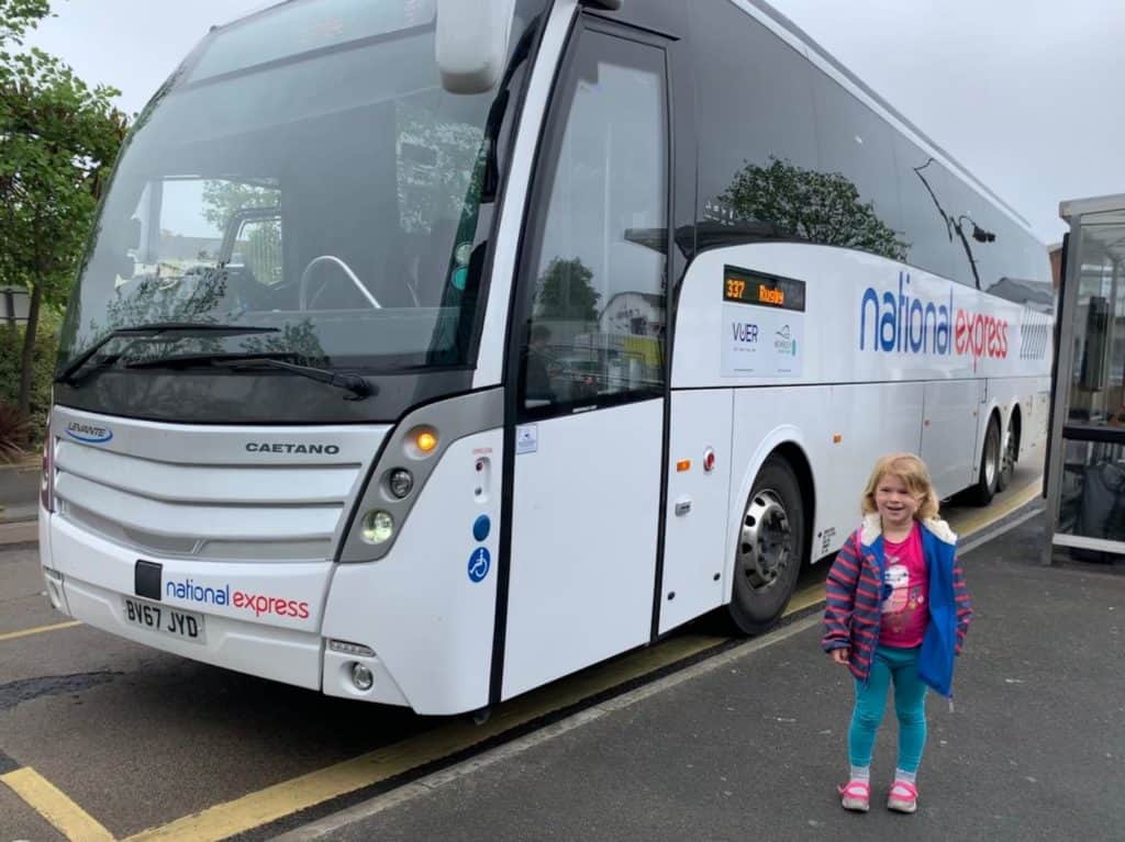 Baby by National Express coach in Paignton