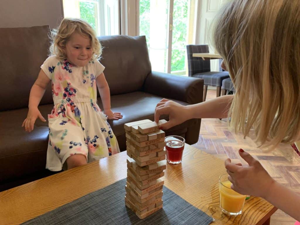 Girls playing Jenga in YHA Bath bar