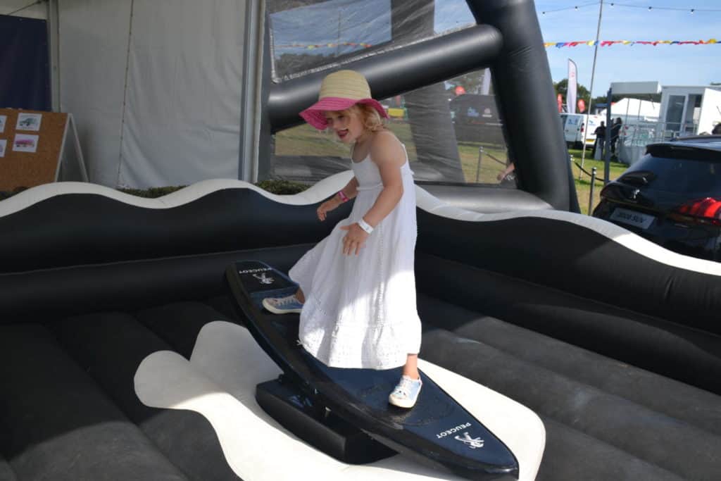 Kid on surf simulator