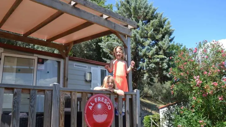 Kids on veranda of our Al Fresco Holidays mobile home