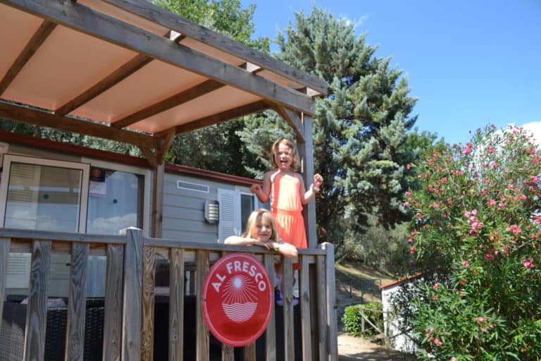Kids on veranda of our Al Fresco Holidays mobile home