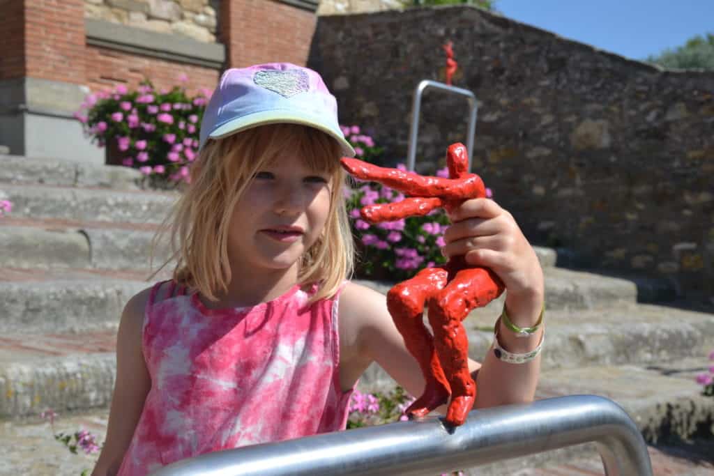 Tot with sculpture on Panzano Arte Trail