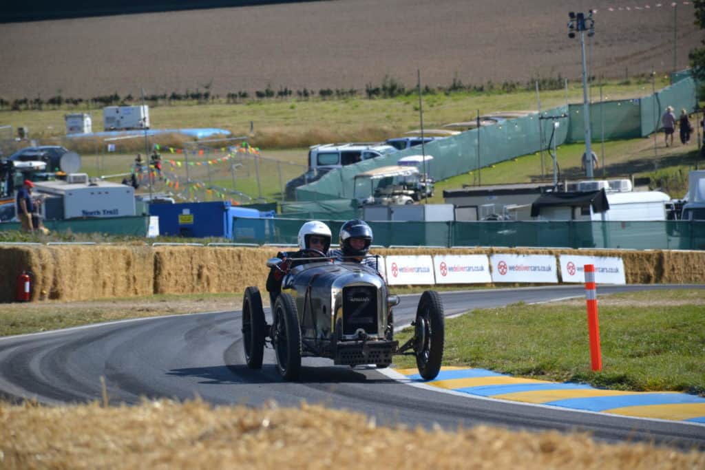 Vintage racing car on track at CarFest South 2019