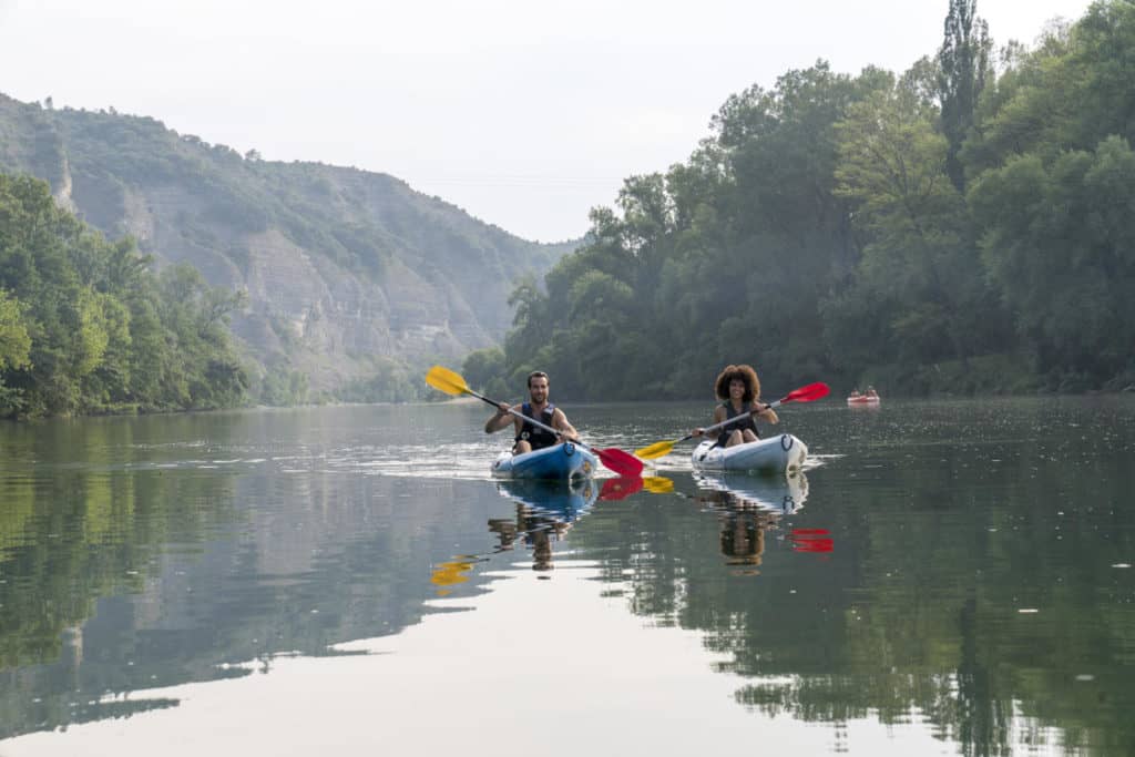 Couple canoeing on the Ardèche river in France