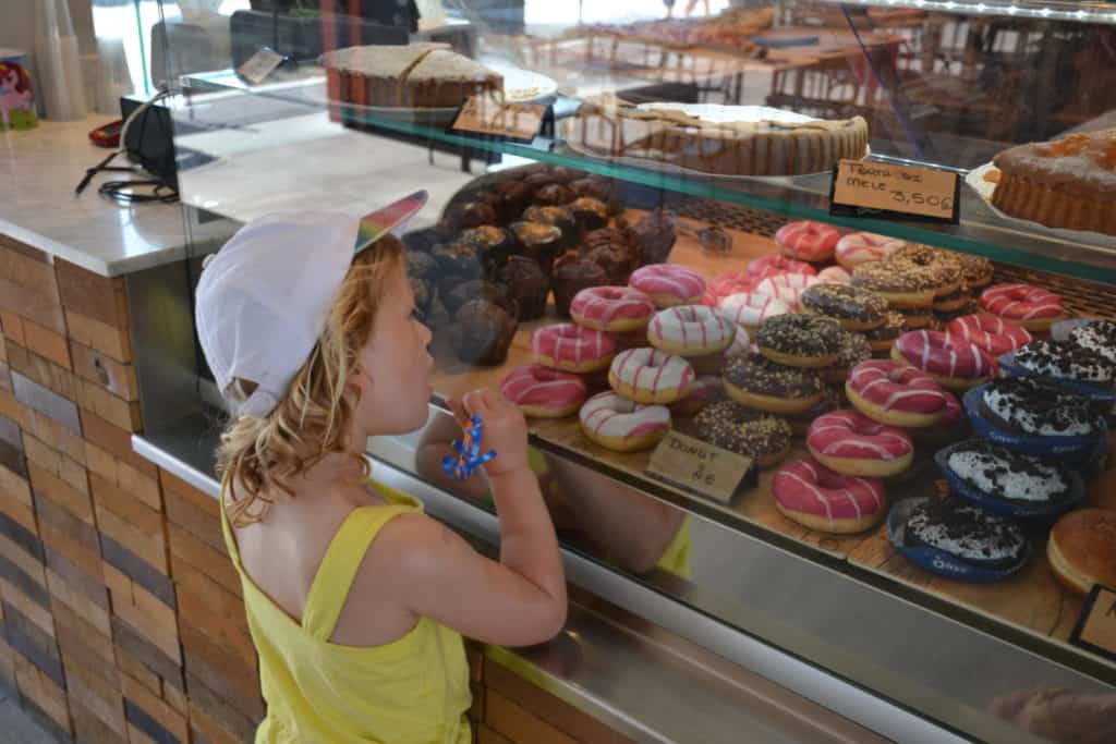 Child looking at donuts