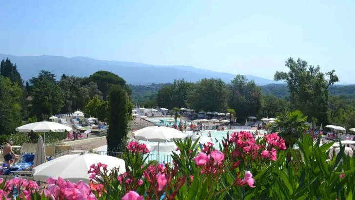 View across upper pool at Norcenni Girasole holiday village in Italy