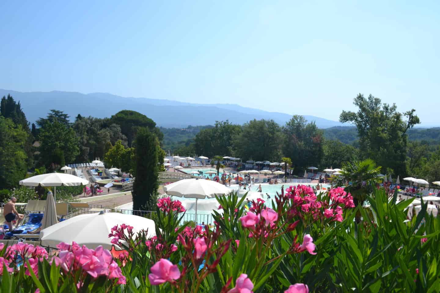 View across upper pool at Norcenni Girasole holiday village in Italy