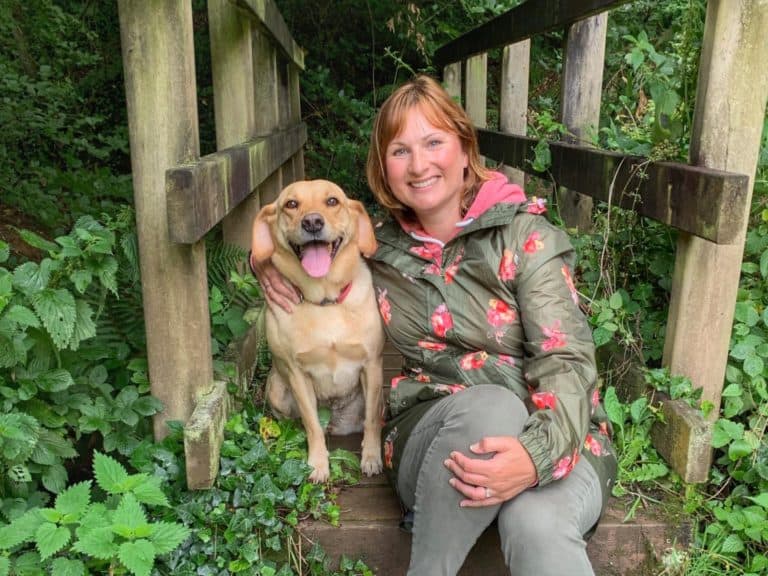 Tin Box Traveller and dog sat on bridge