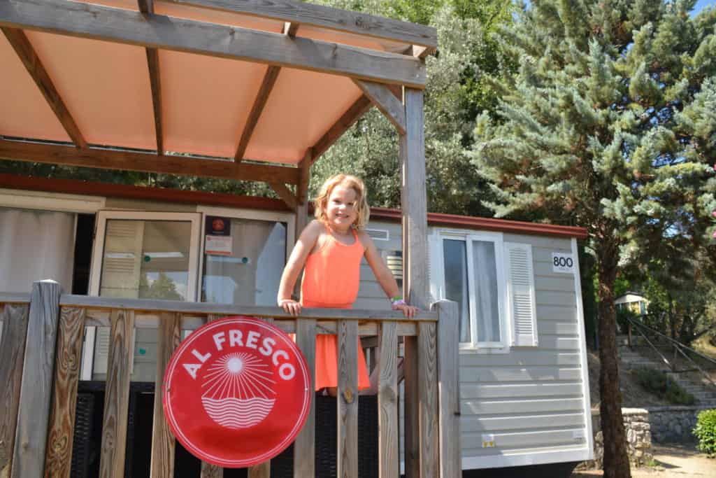 Baby on mobile home veranda