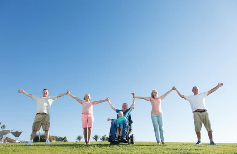 Family group on a hill enjoying and wheelchair friendly day out