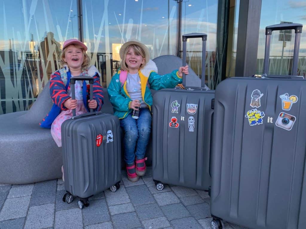 Kids with suitcases - how to save money on flights