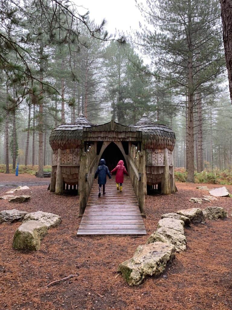 Kids walking into tree house at Moors Valley Country Park play trail
