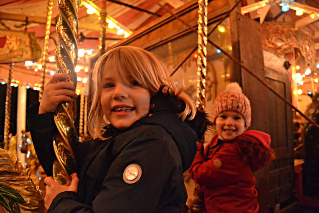 Tin Box Traveller girls on carousel at Crealy Theme Park in Devon