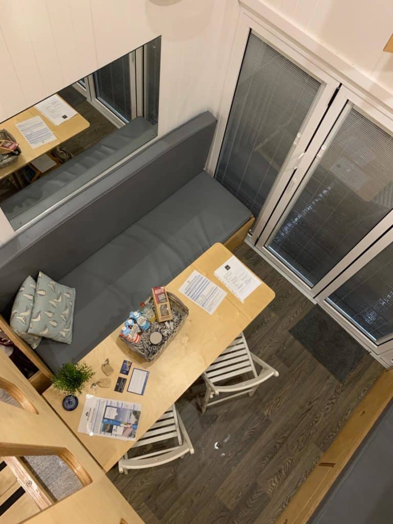 View of downstairs from upstairs balcony in beach lodge