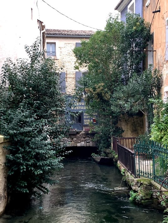 Low bridge over river in Isle-sur-la-Sorgue, France