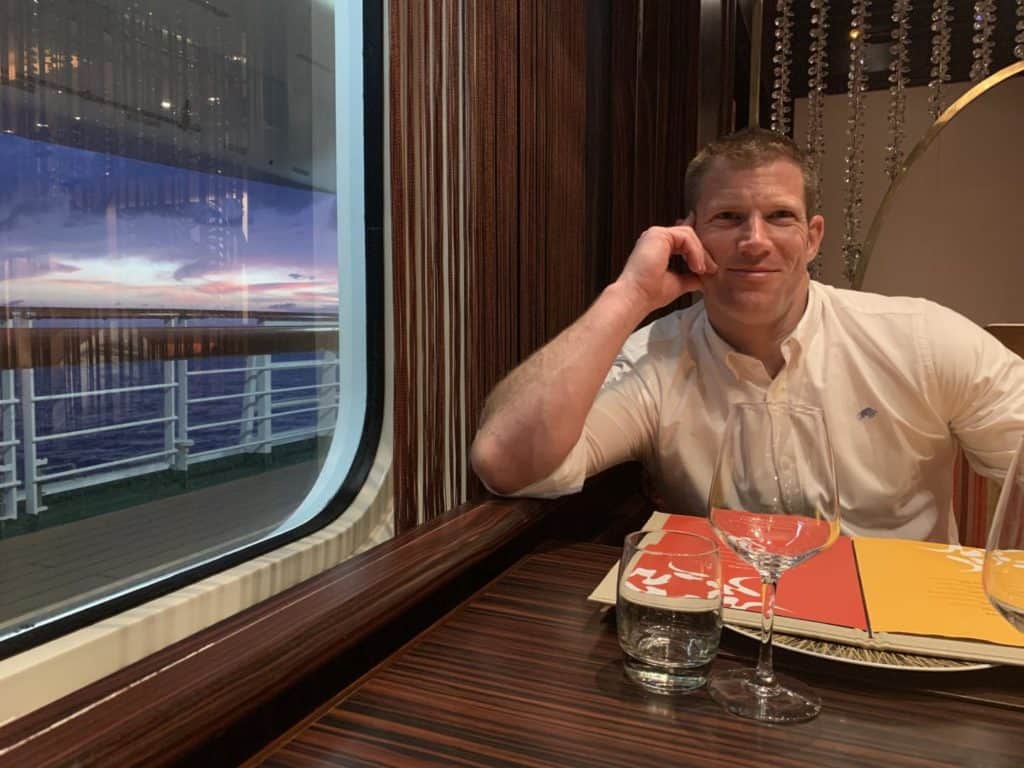 Mr Tin Box in Sindhu restaurant on P&O Azura while the sun sets out of the window