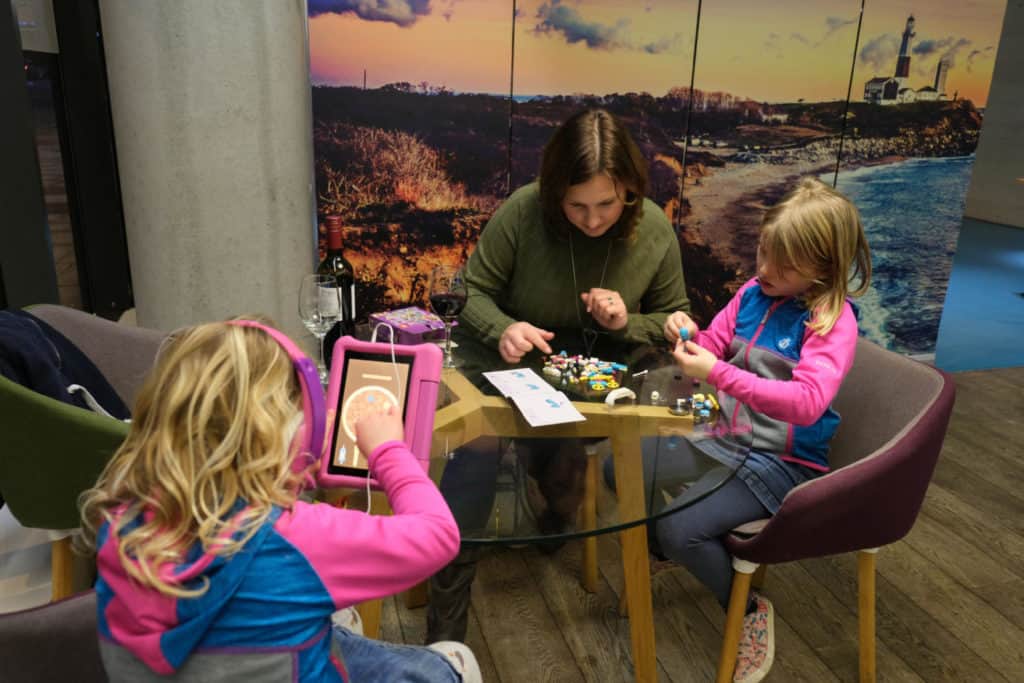 Claire and Tot make lego while Baby plays on her tablet