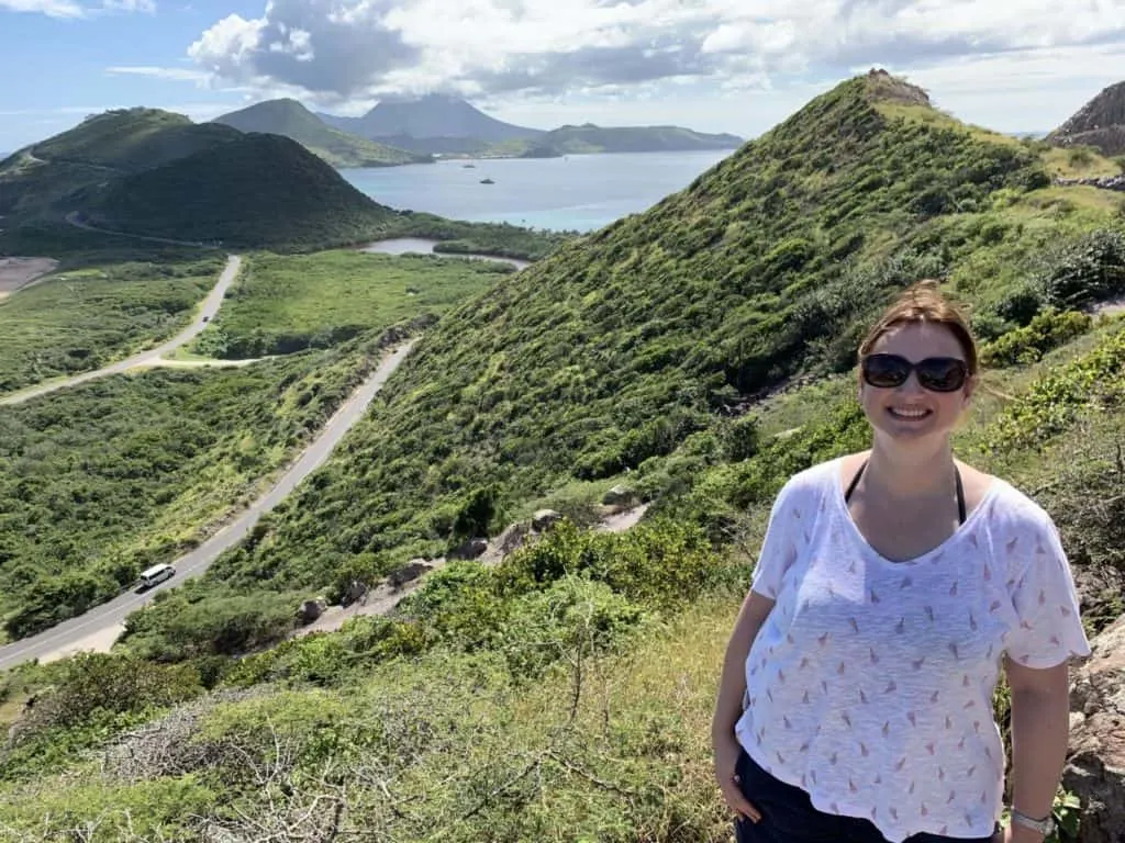 Claire standing in front of view from St Kitts to Nevis