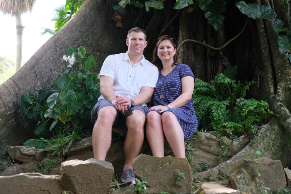 Claire and Mr Tin Box sat in St Vincent's Botanical Garden in the Caribbean