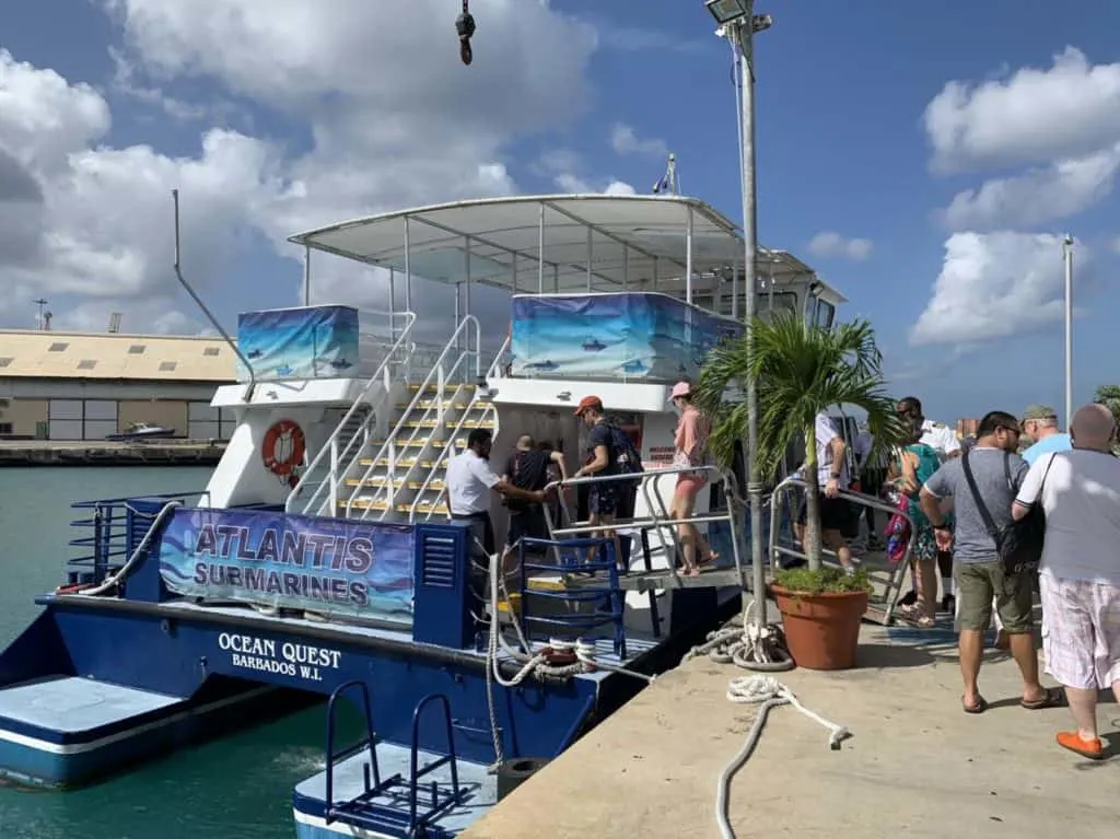 People boarding the Ocean Quest Catamaran that takes you out to the site where the Atlantis Submarine dives