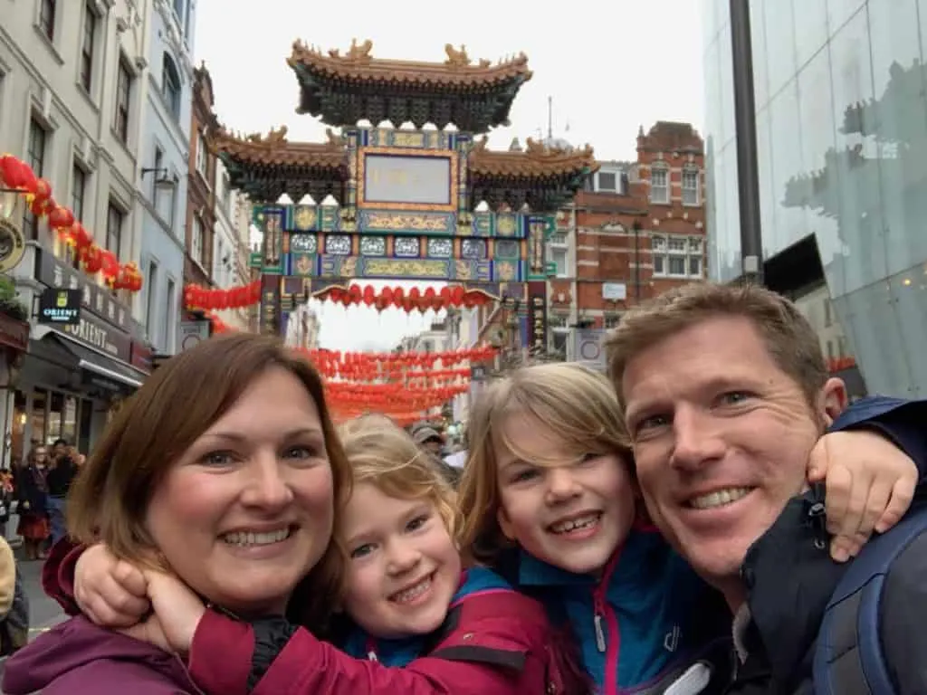 Tin Box family stood in front of Chinatown in London