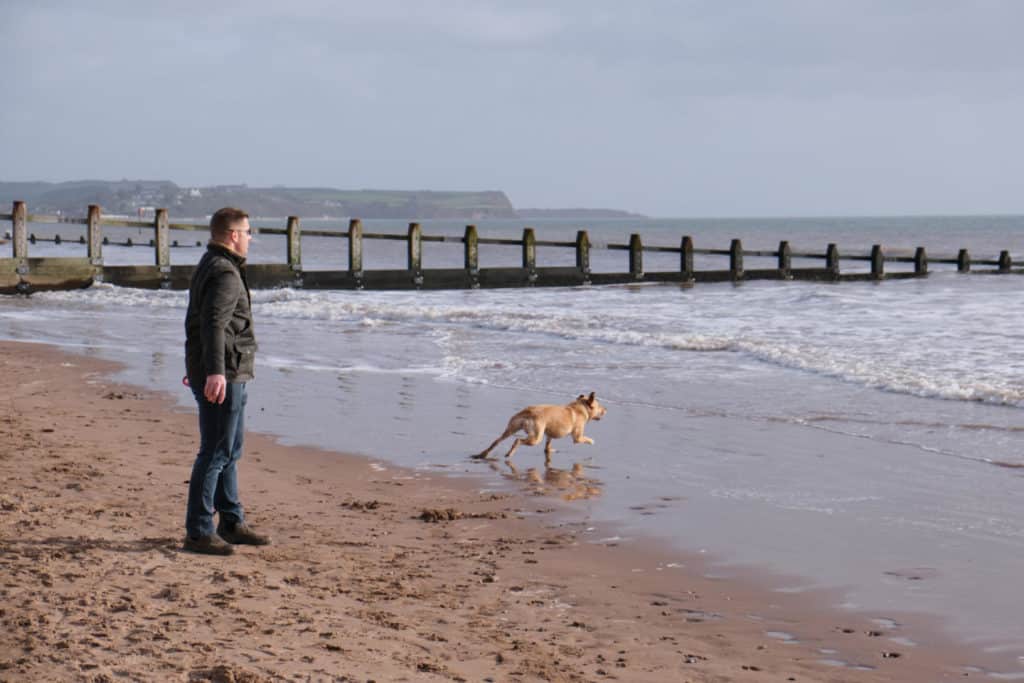 Mr Tin Box and Dog playing on the beach at Dawlish Warren