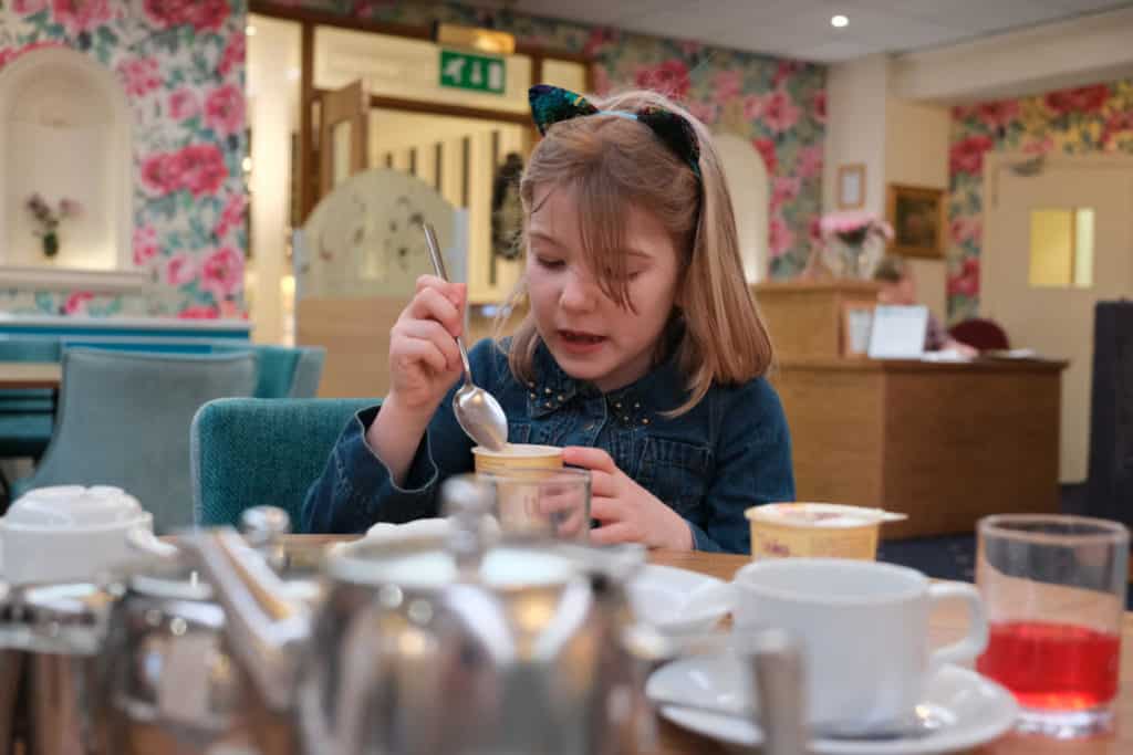 Tot eating breakfast in the Lincoln Restaurant at Langstone Cliff Hotel