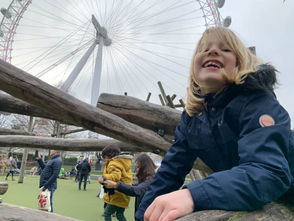 Tot on Jubilee park playground with The London Eye in the background