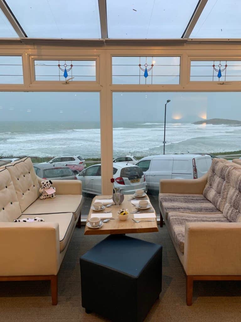Hotel lounge with view of Fistral Beach in Newquay, Cornwall