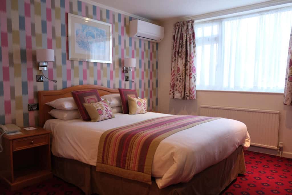 Master bed in family suite at Langstone Cliff Hotel