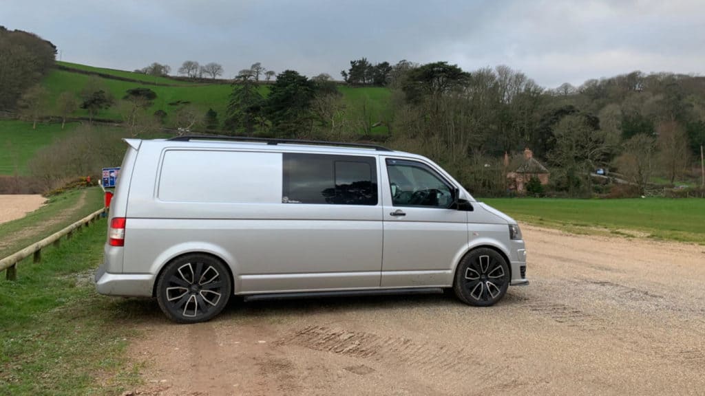VW T5 transporter van parked in beach car pack in Devon
