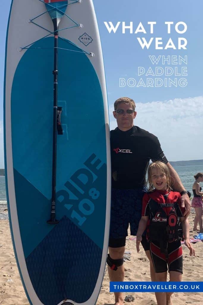 You need more than something to ride to try out stand up paddle boarding or SUP with your family. Here’s what we recommend you wear paddle boarding with kids for comfort, safety and practicality #SUP #paddleboard #watersport #beach #outdoors #fun #family #kids #TinBoxTraveller #wear #clothes #equipment