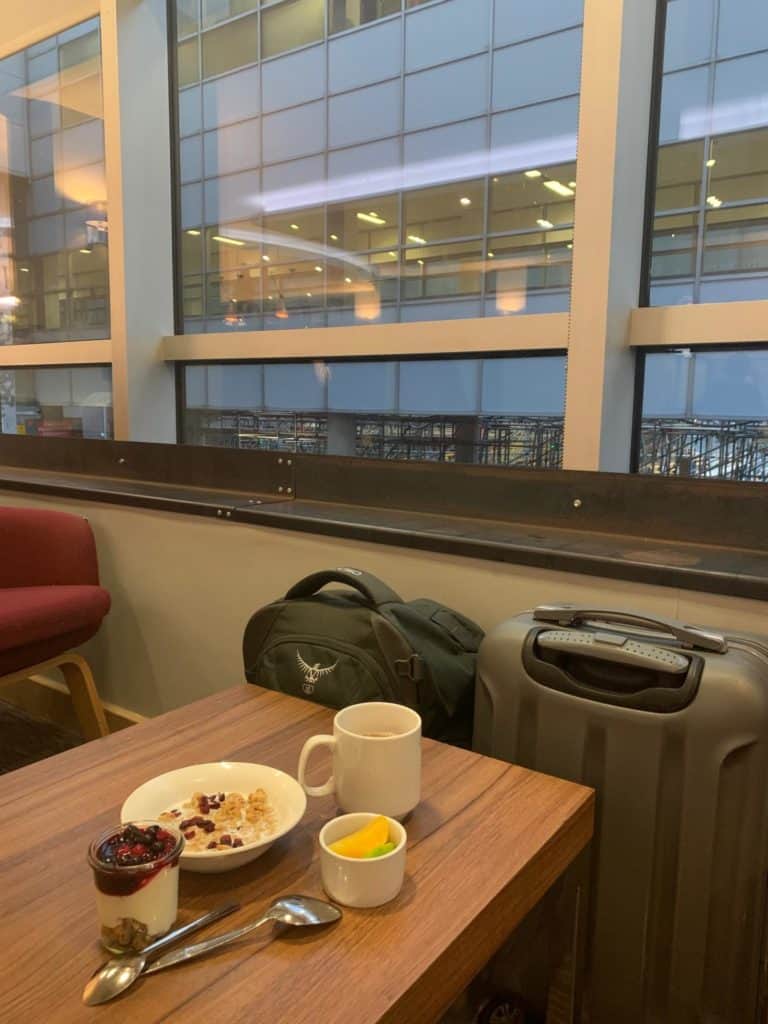 Window table with breakfast plates in Club Aspire Gatwick North terminal