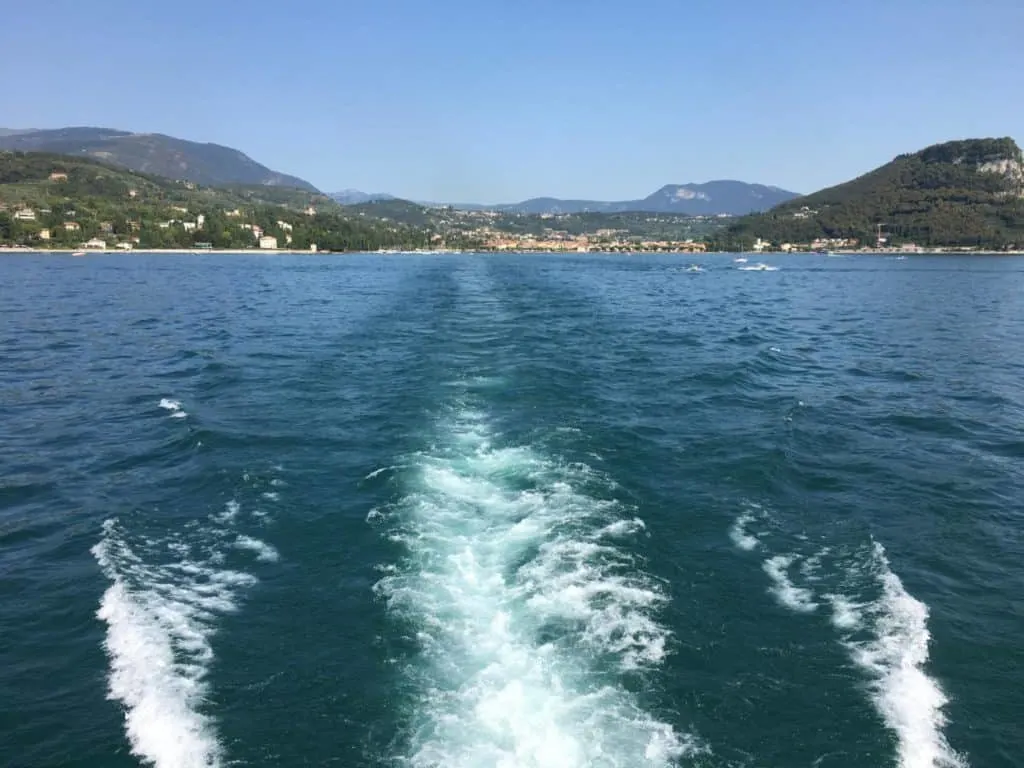 Boat trail through the water of Lake Garda in the Italian Lakes