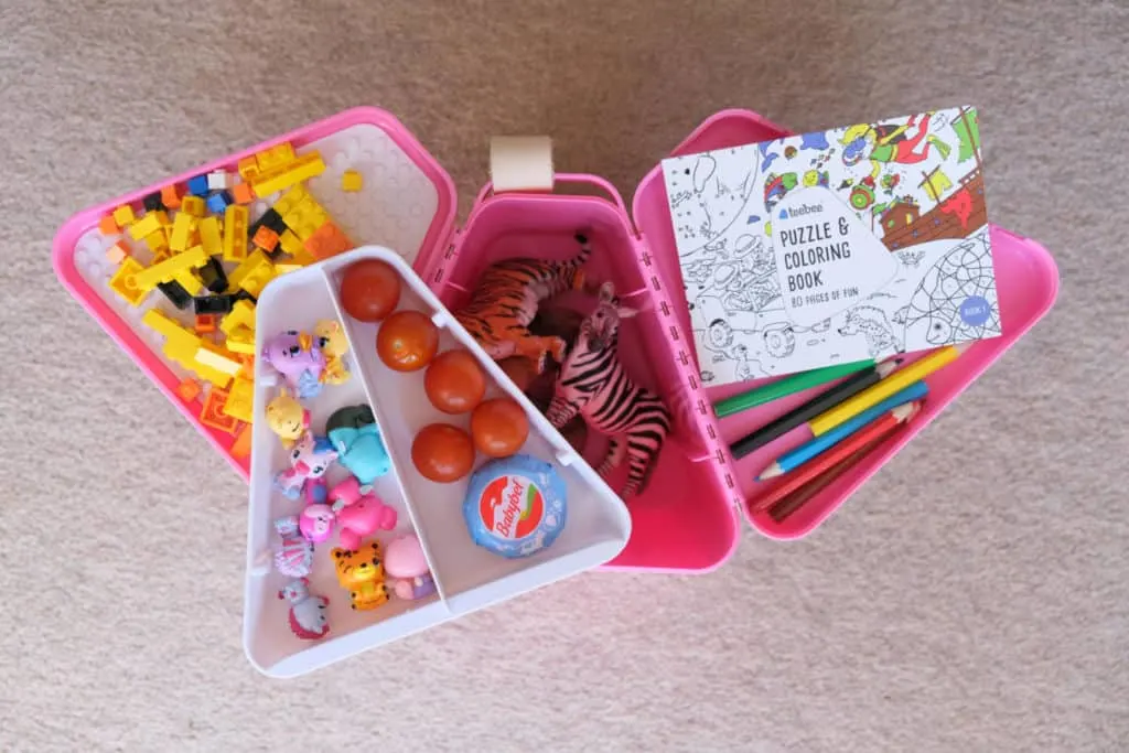 Trays of Teebee box loaded with small toys, colouring book, building blocks and snacks