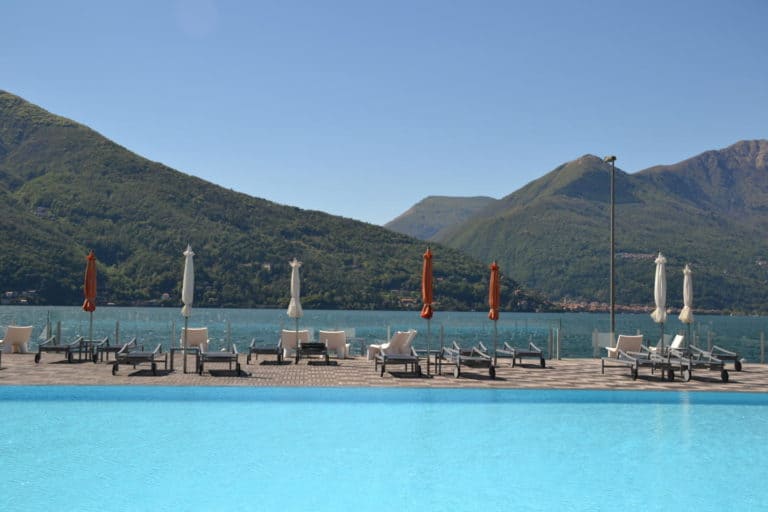 View of Lake Maggiore from the poolside of Golfo Gabella resort in Maccagno in the Italian Lakes