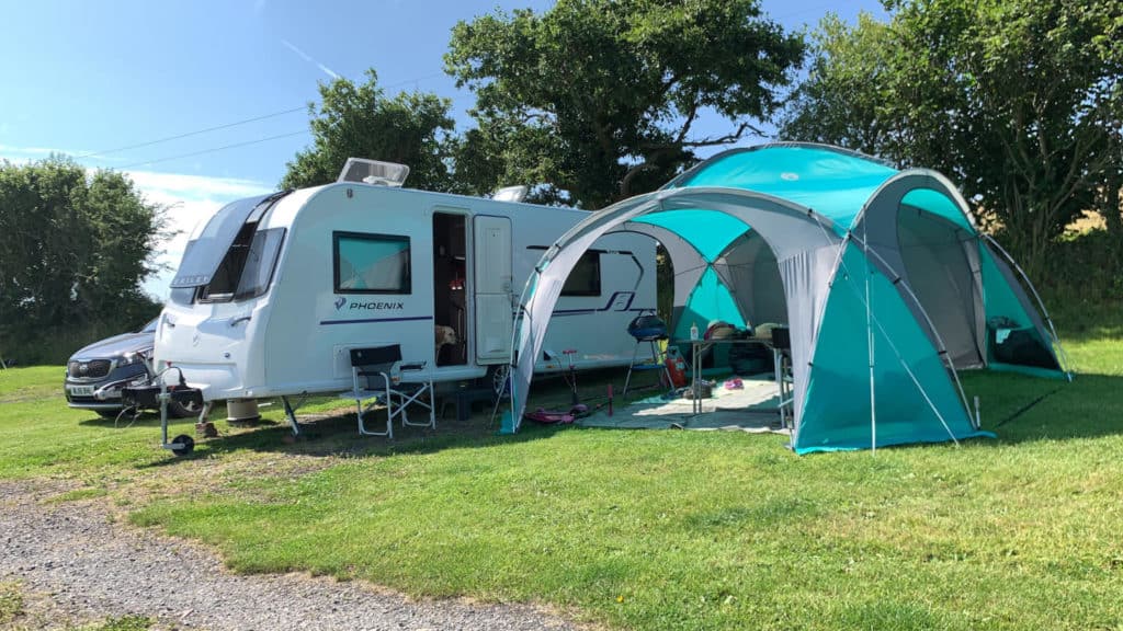 Bailey caravan and Coleman event dome on campsite