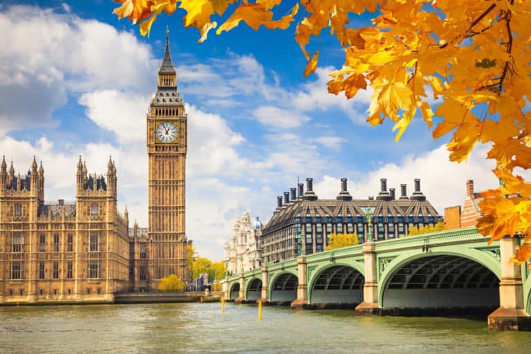 Big Ben with autumn leaves in London