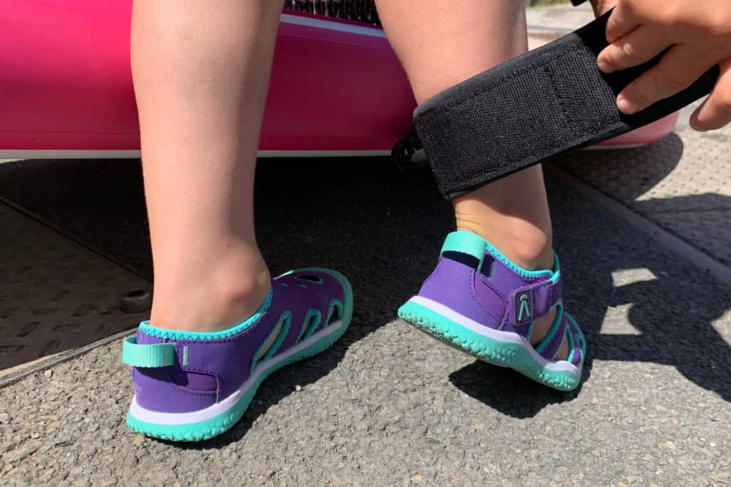 Child's feet wearing KEEN Stingray water shoes for kids