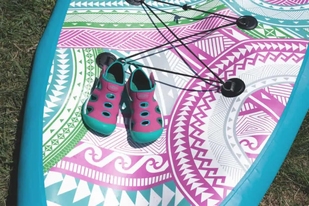 Kids water shoes on paddle board