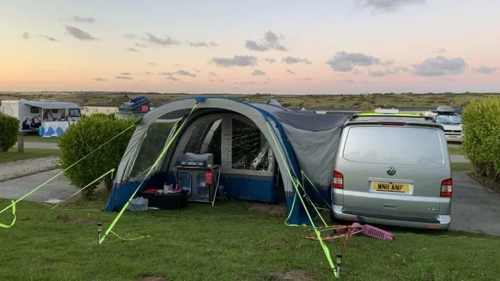 OLPRO Cocoon Breeze inflatable awning on camper van at campsite