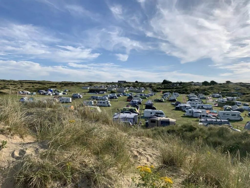 Caravans and tents on Perran Sands Holiday Park campsite
