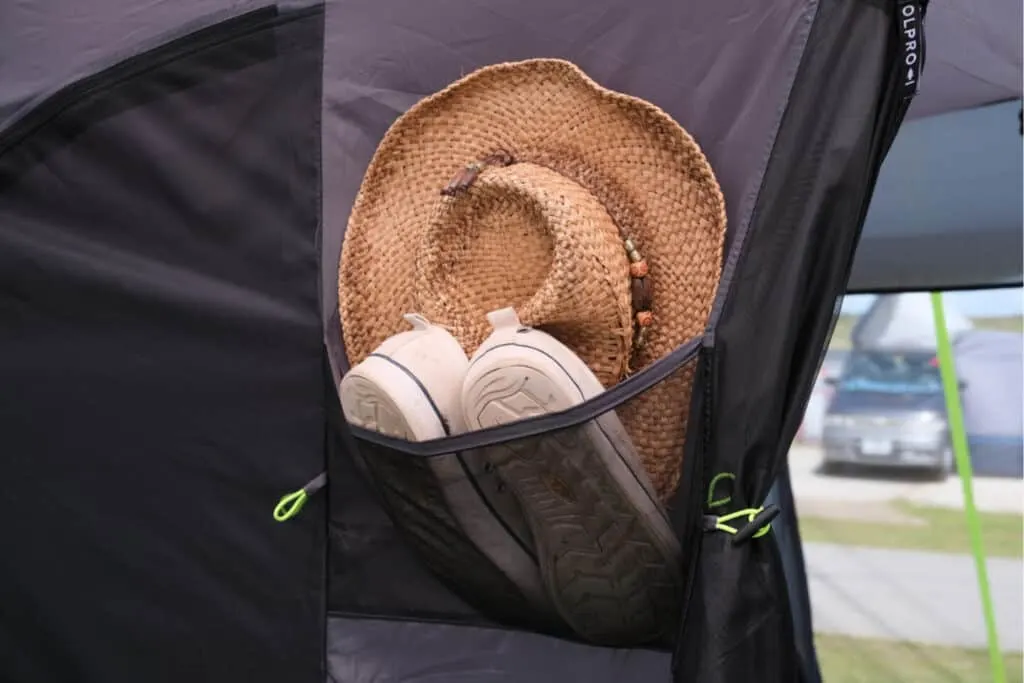 Hat and shoes in pocket of awning