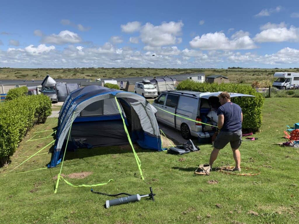 Mr Tin Box attaching storm straps to awning